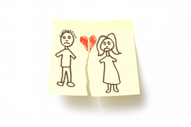 couple's love drawn on paper being ripped apart