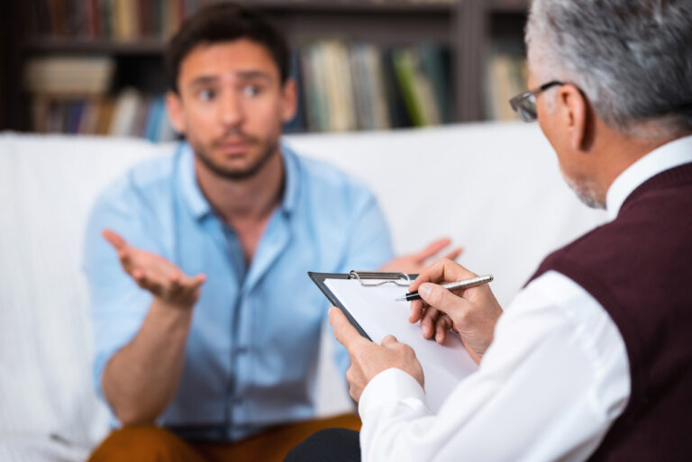 Man talking to a psychologist or counselor