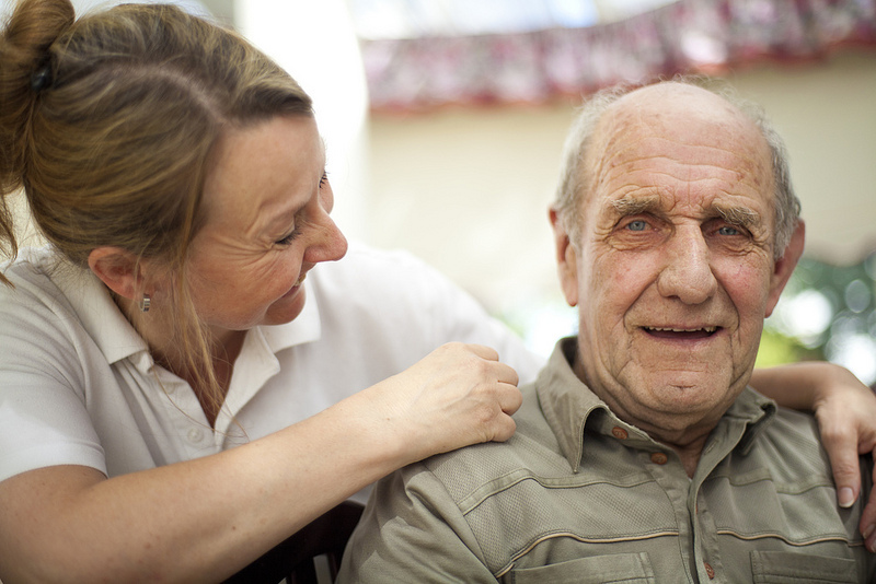 Person Enjoying Taking Care Of Elderly Person