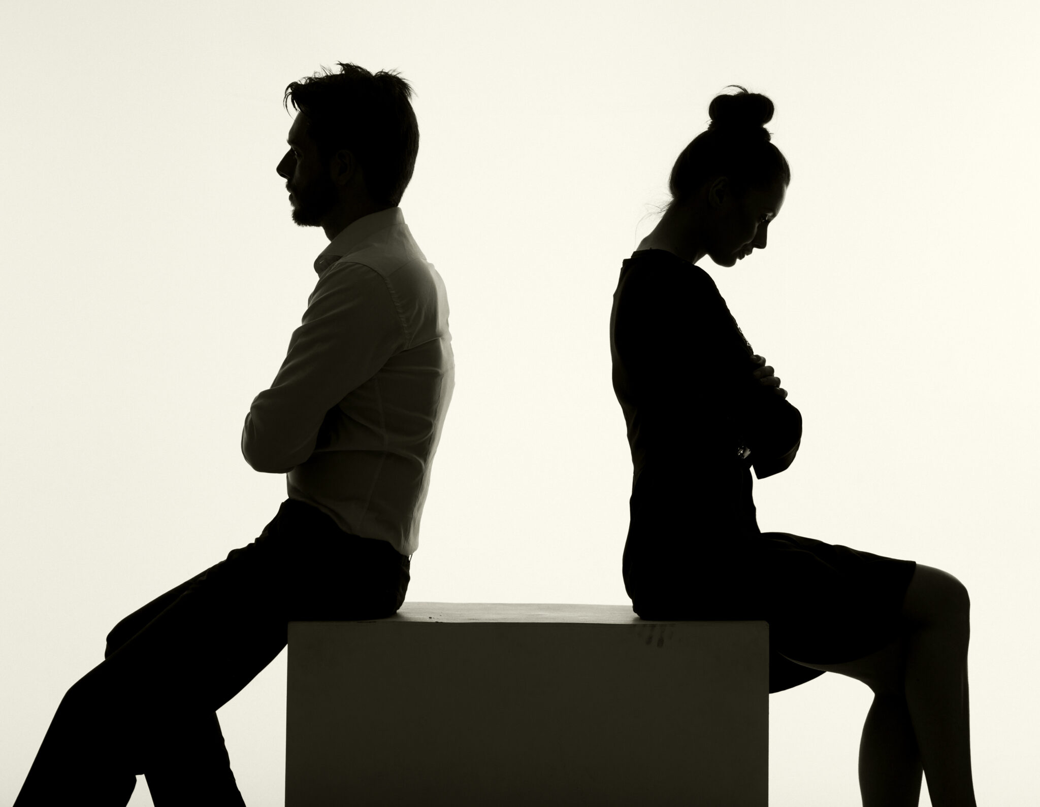 conflicted couple back to back
